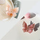 Top view of Beau double layer butterfly claw clip showing symmetrical wings