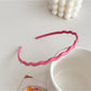 Gifty sweet solid color wavy headband packaged in branded box