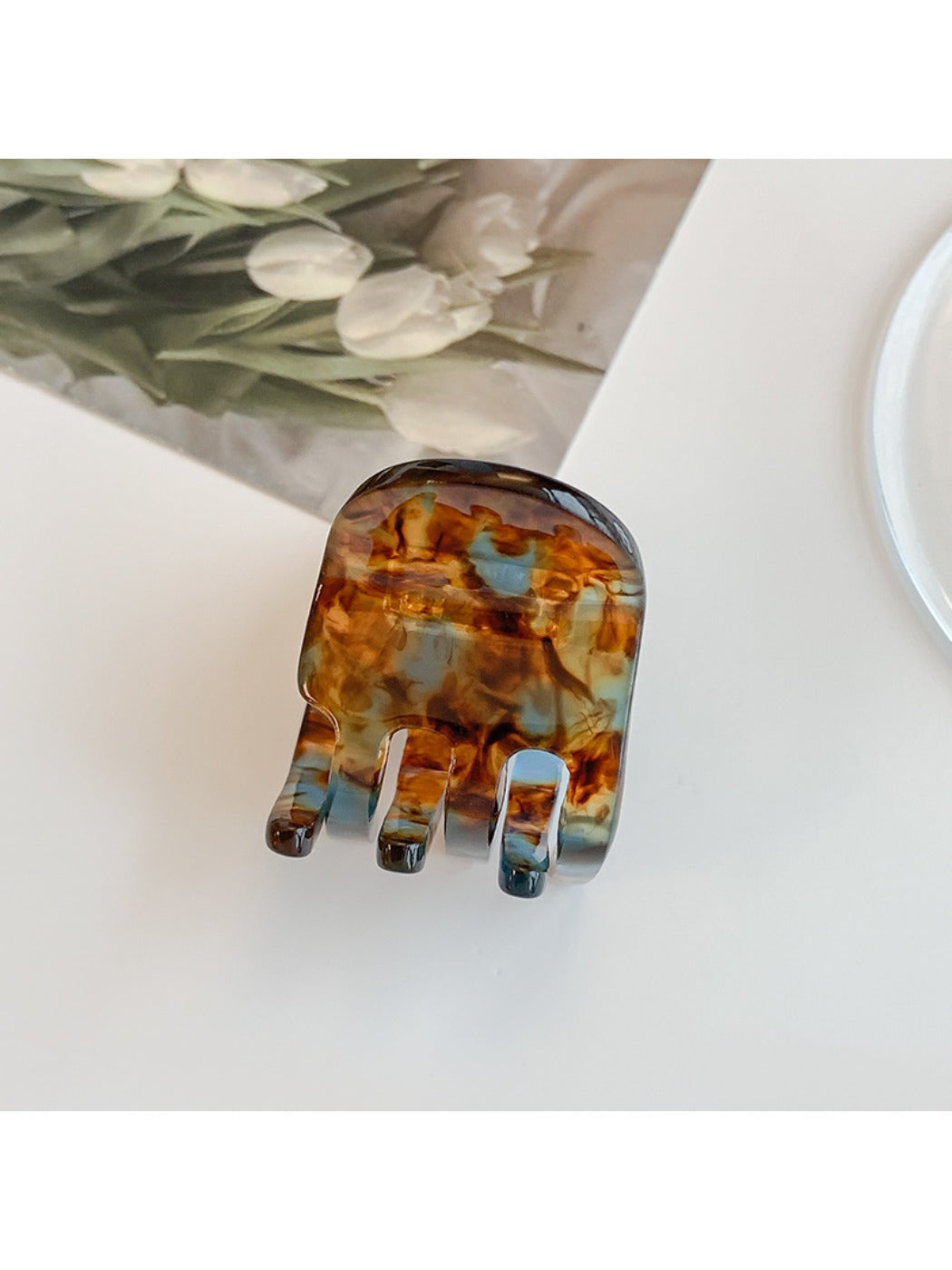 Beau hair clip positioned next to matching accessories for styling inspiration