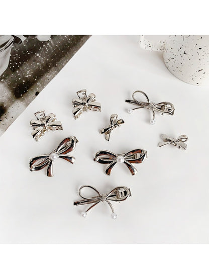 Close-up of Beau classic bow hair clip showing fabric texture and clip mechanism