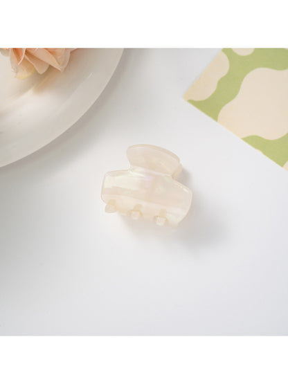 Top view of Beau hair clip emphasizing symmetrical retro design