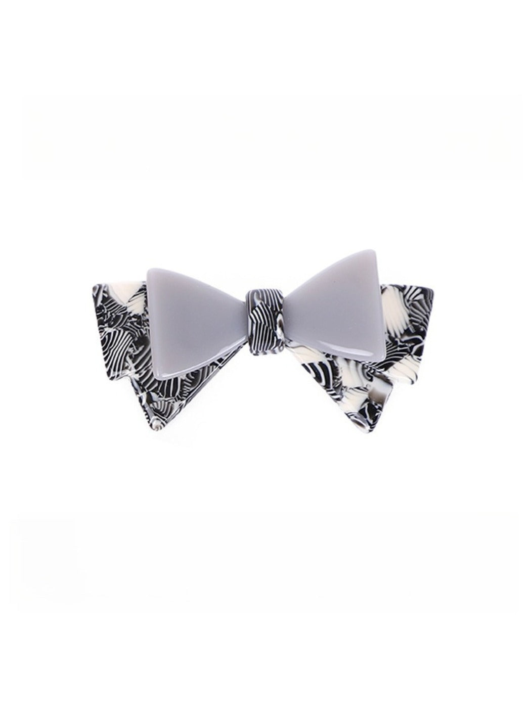 Top view of Beau hair clip focusing on bow shape and fabric folds