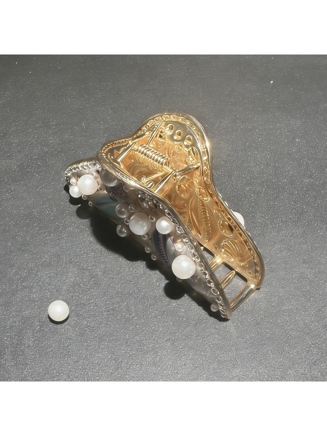 Beau hair clip displayed on a sandy beach setting with seashells