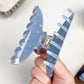 Beau hair claw clip holding a section of blonde hair