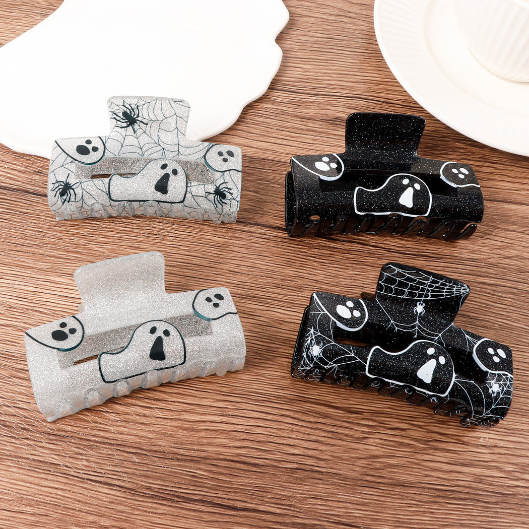 Halloween ghost and spiderweb hair claw motif overview