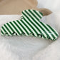 White and green striped hair claw clip, front view