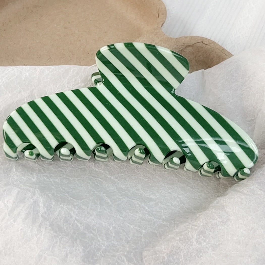 White and green striped hair claw clip, front view