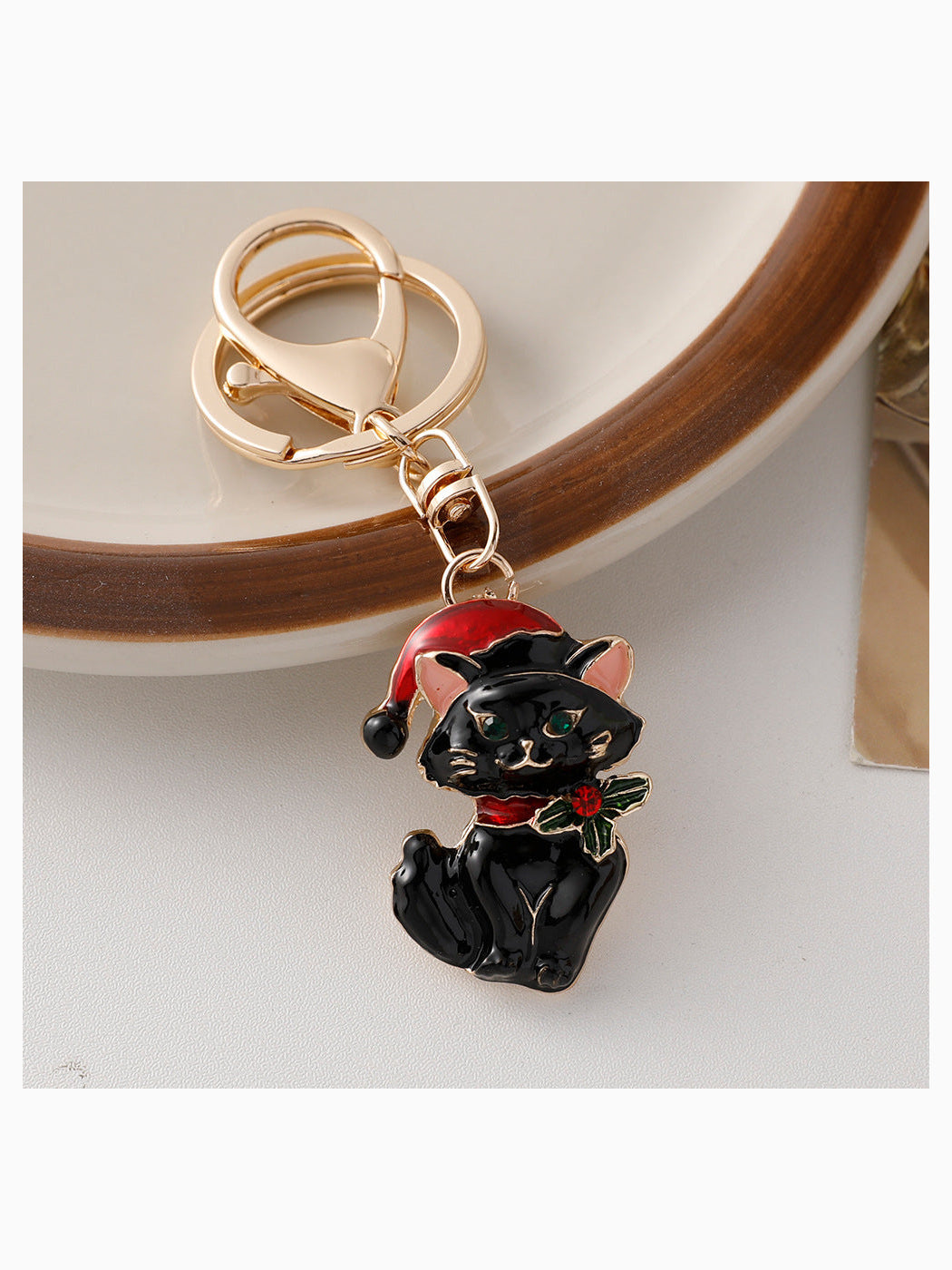 Black Christmas cat keychain with Santa hat and holly