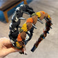 Gifty twist headband displayed on a white mannequin head