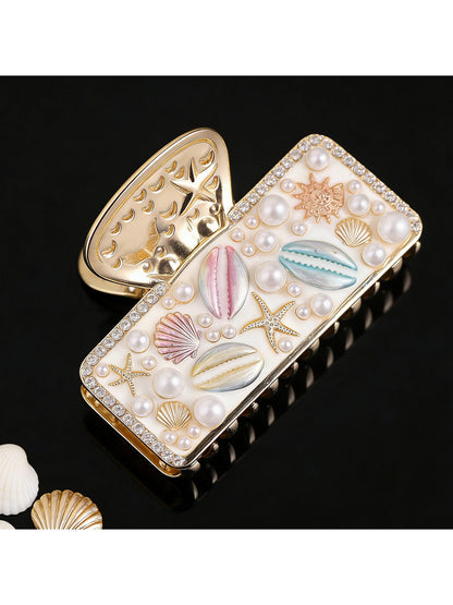 Top view of Beau beach style hair clip highlighting intricate shell details