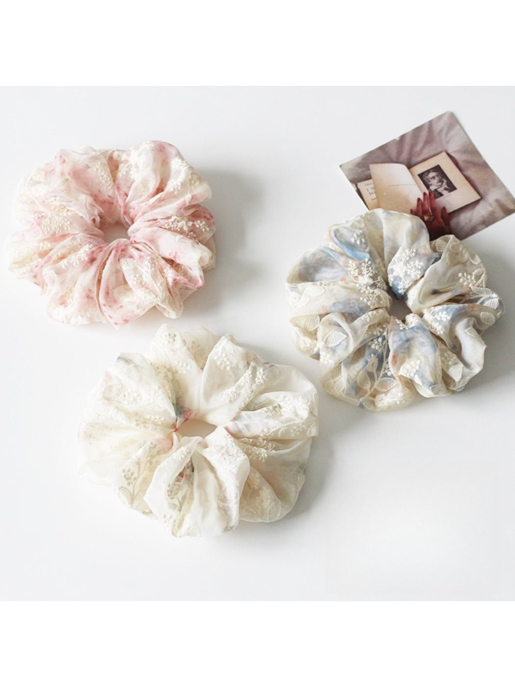 Gifty ruched scrunchie showing gathered fabric texture and vibrant print