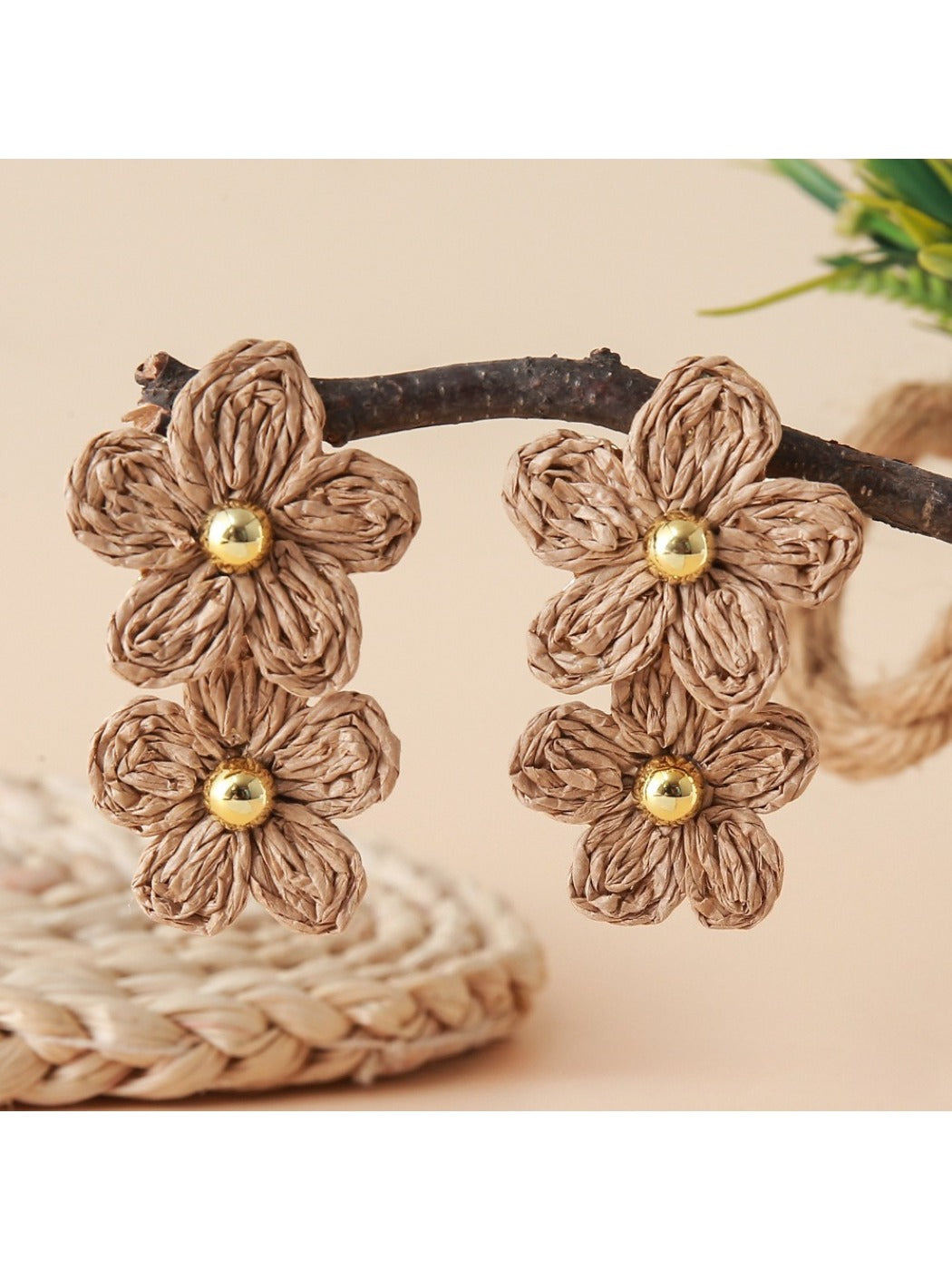 Model wearing earedge flower shaped raffia drop earrings with casual outfit