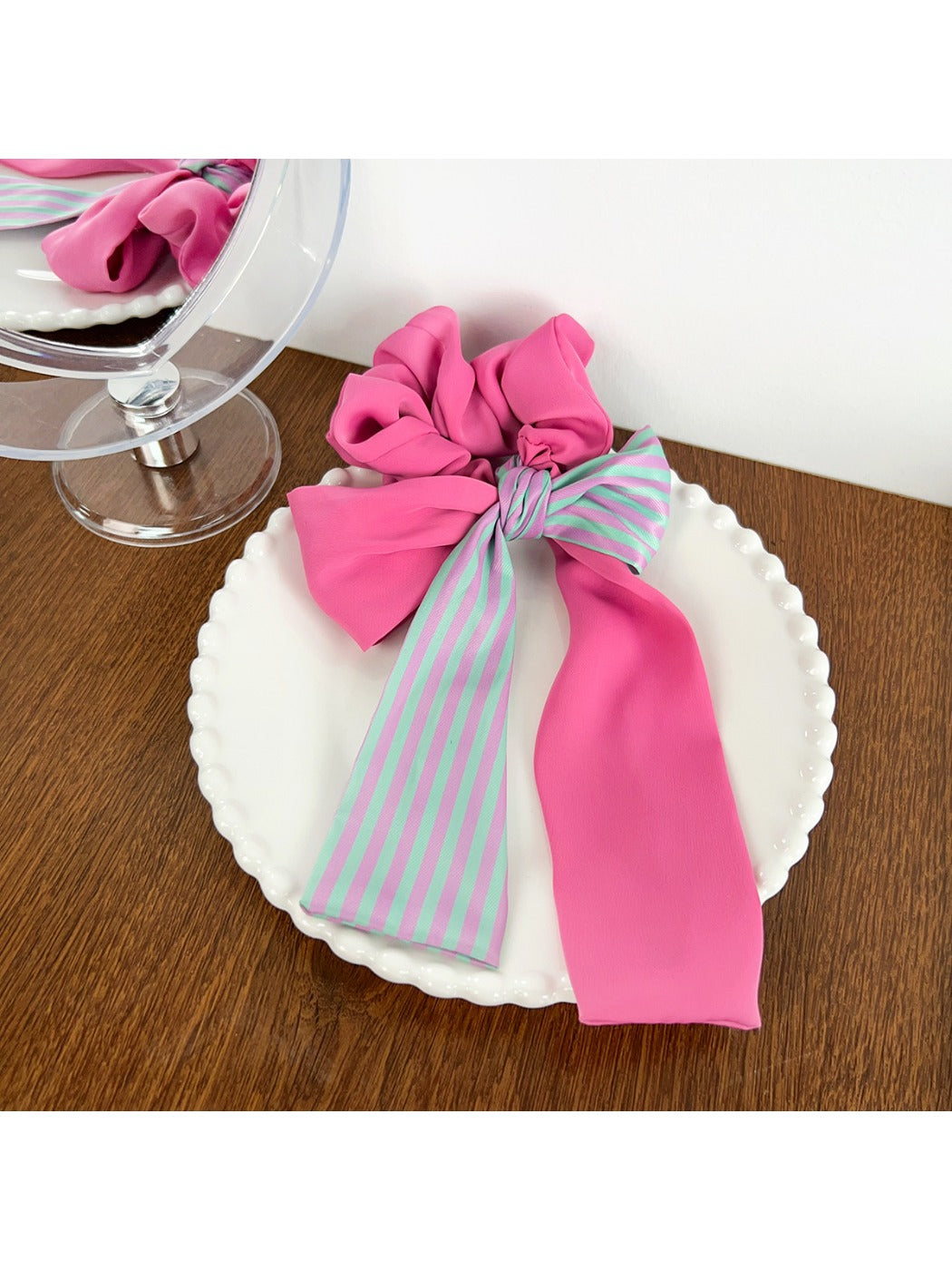 Magenta striped scrunchie packaged for retail display