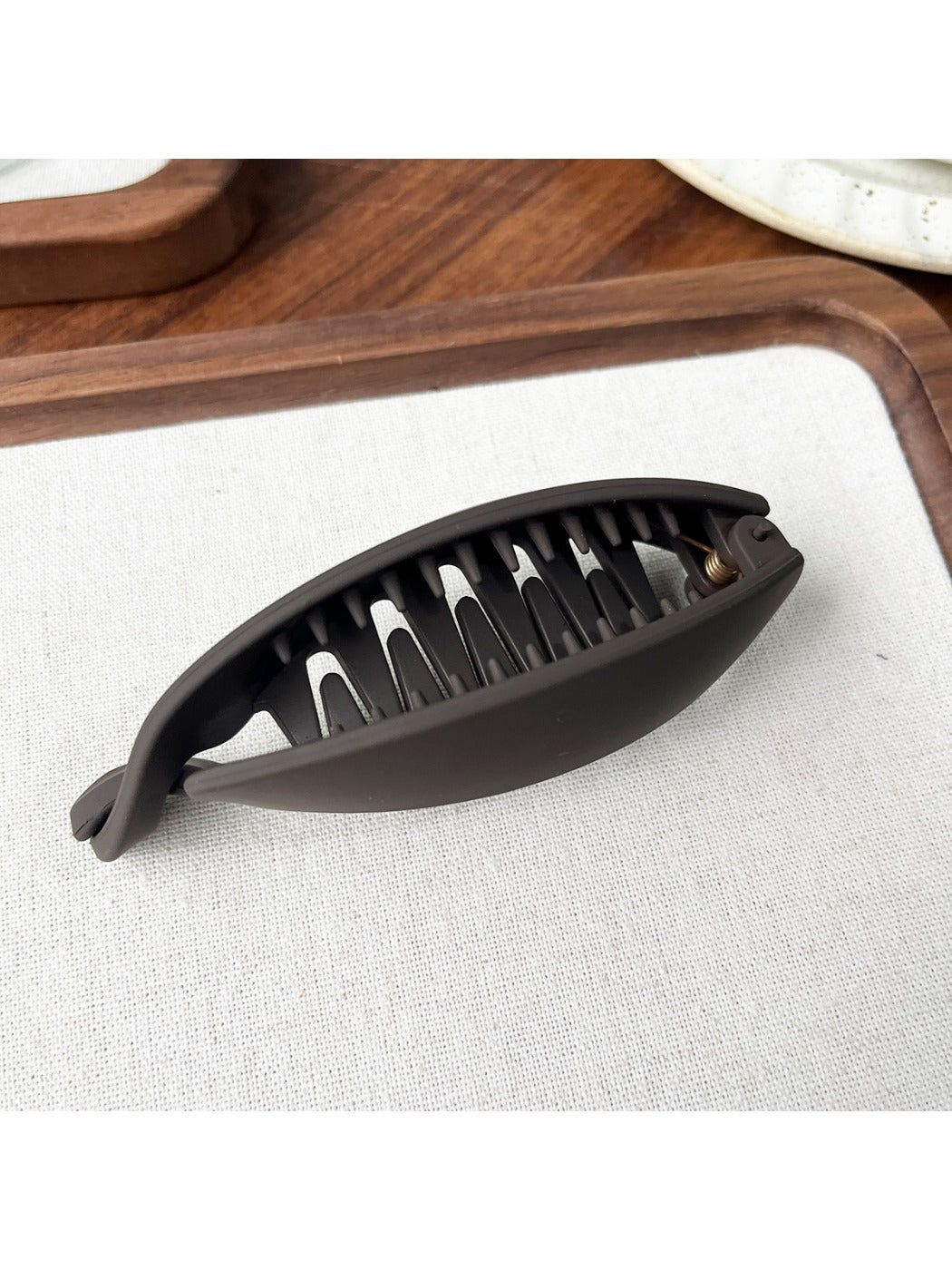 Top view of Beau minimalist hair clip highlighting its curved design