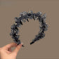 Leopard print tulle headband styled with casual outfit on model