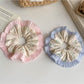Gifty scrunchie showing ruffled edges and delicate floral pattern