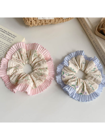 Gifty scrunchie showing ruffled edges and delicate floral pattern