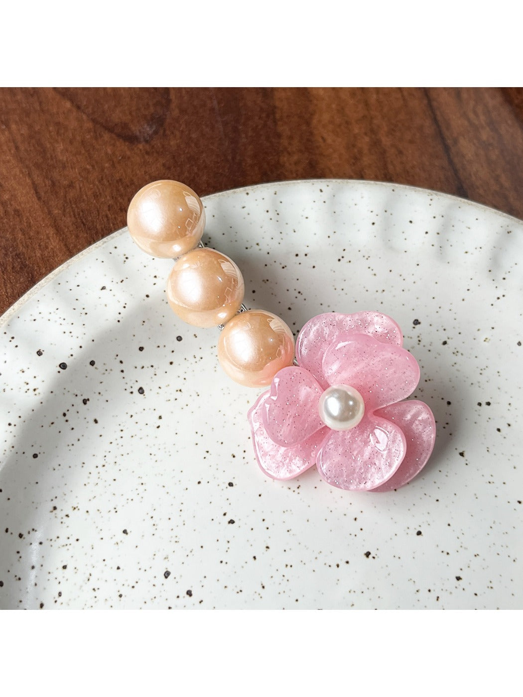 Beau Camellia beaded hair clip displayed with packaging box