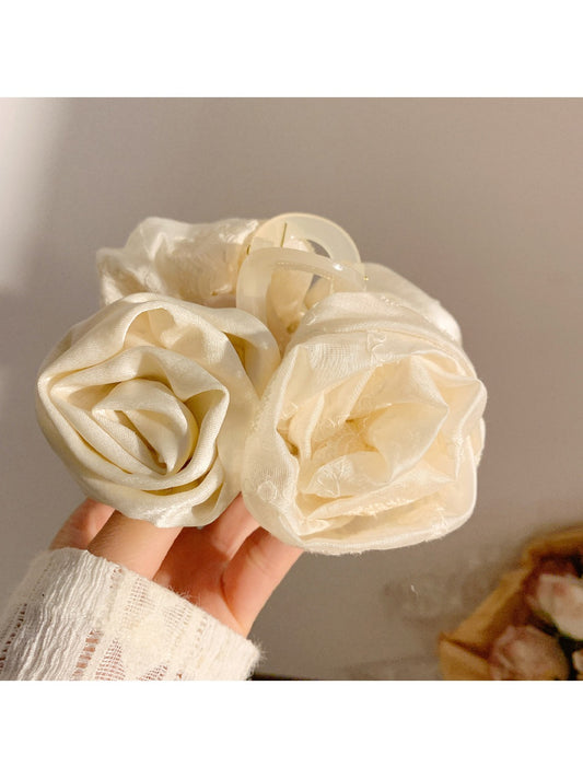 Beau hair claw clip with elegant rose decoration in soft pink and gold accents