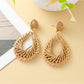 Detailed shot of the woven pattern on Earedge hollow drop earrings