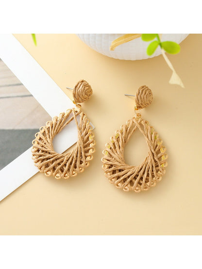 Detailed shot of the woven pattern on Earedge hollow drop earrings