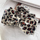 Beau leopard print claw clip partially open showing teeth design