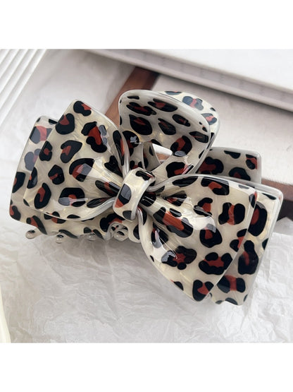 Beau leopard print claw clip partially open showing teeth design