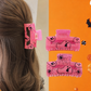 Pink Halloween ghost and spiderweb hair claw lifestyle view