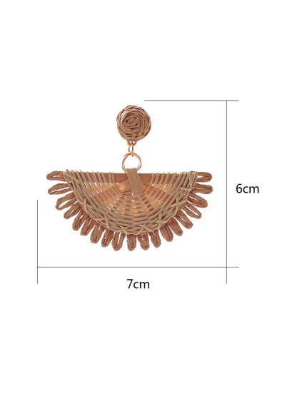 Side view of raffia fan shaped drop earrings showing woven texture