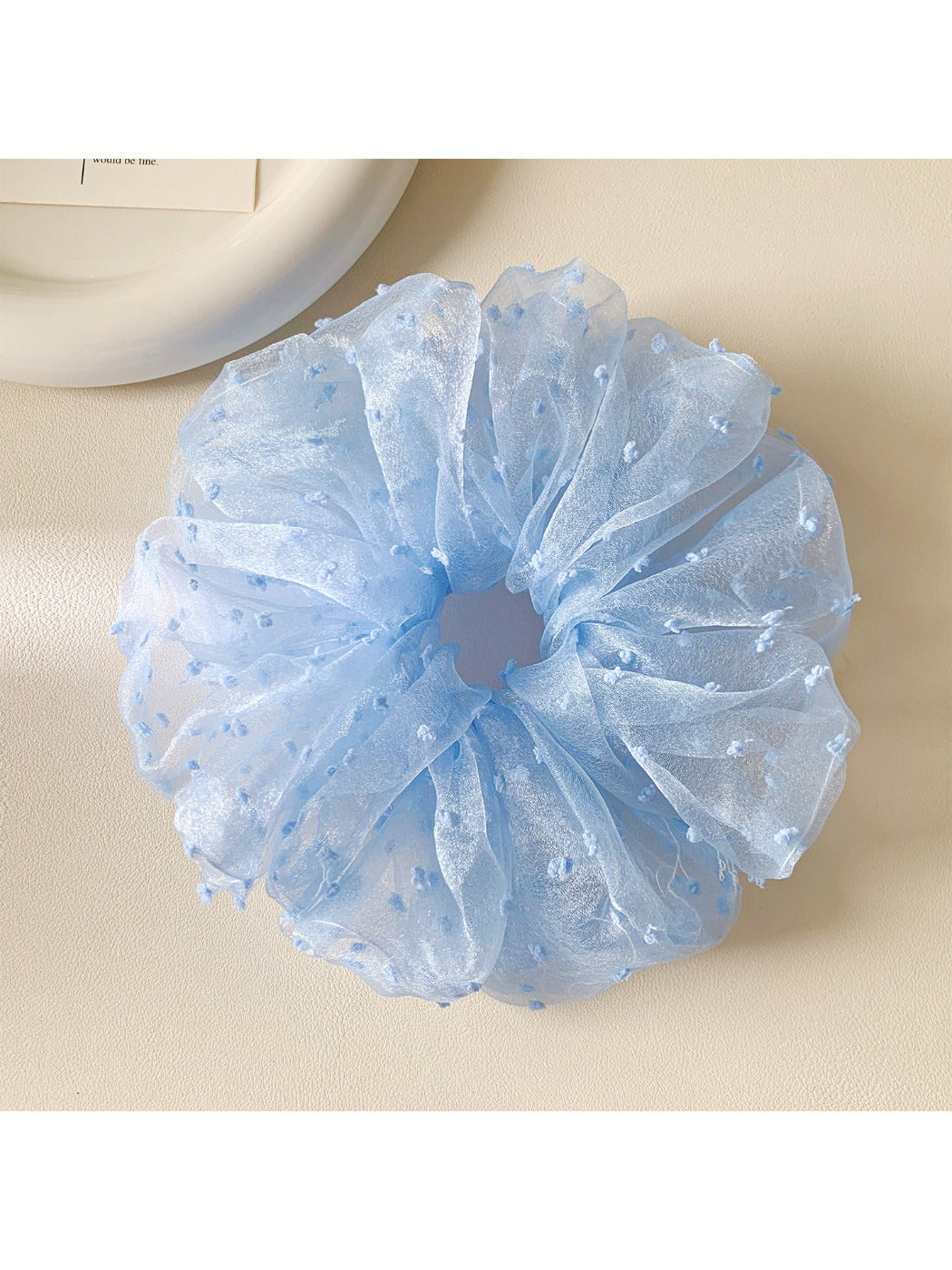 Gifty solid color polka dot scrunchie displayed flat to show full pattern and design