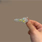 Close-up of Beau key shaped hair clip in gold metal finish