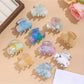 Beau vibrant acetate hair clip in tortoiseshell pattern on white background