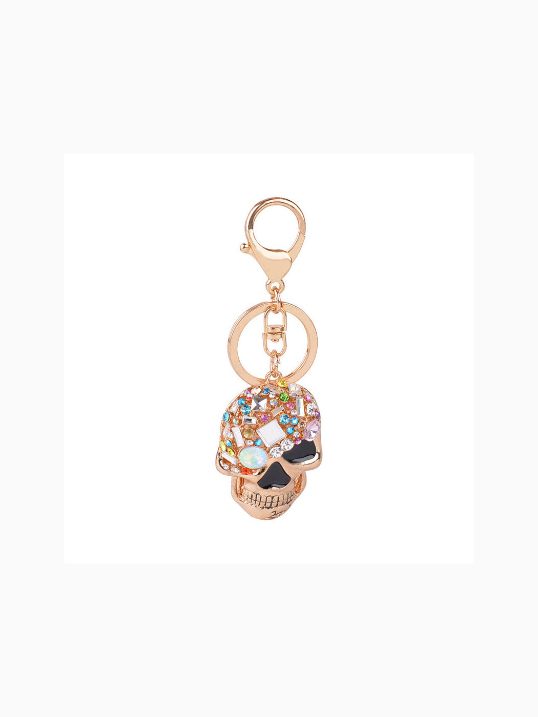 Gold-tone multicolor faceted skull keychain on white background