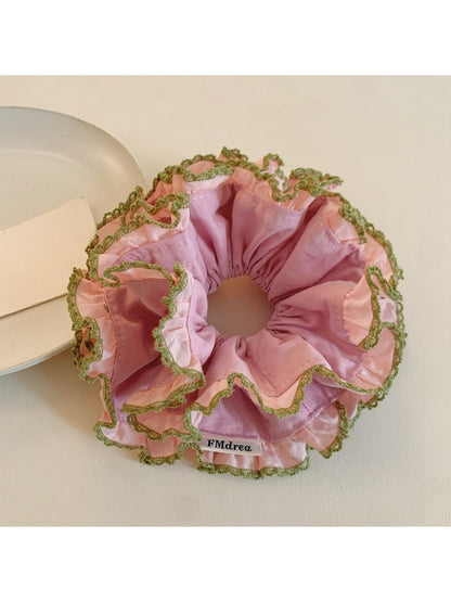 Close-up of pink lace trim detail on double scrunchie