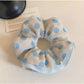 Gifty polka dot scrunchie displayed on a white background