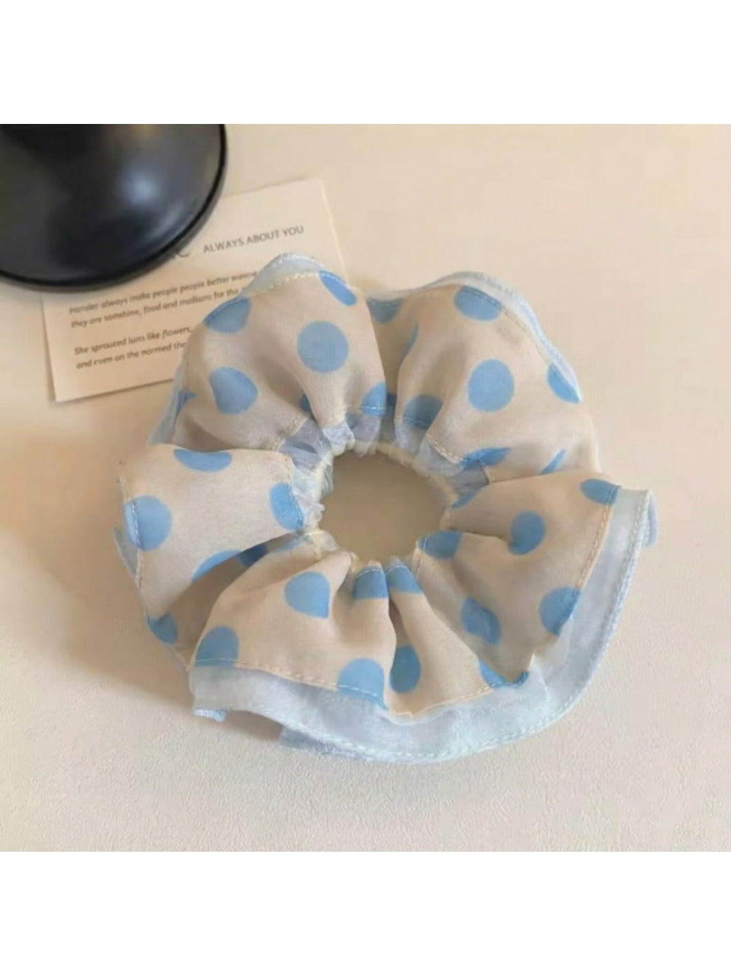 Gifty polka dot scrunchie displayed on a white background
