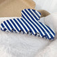 Blue and white striped hair claw clip, front view