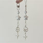 Star-shaped keychain reflecting rainbow colors held in hand