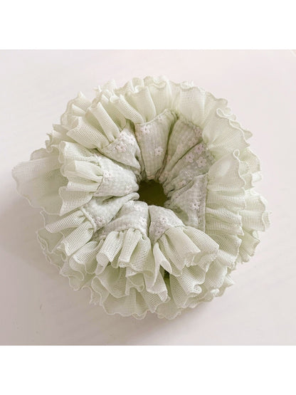 Close-up of Gifty sweet printed ruched scrunchie with pastel floral pattern