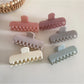 Side view of Beau rectangular hair clip in pastel blue with metal clasp