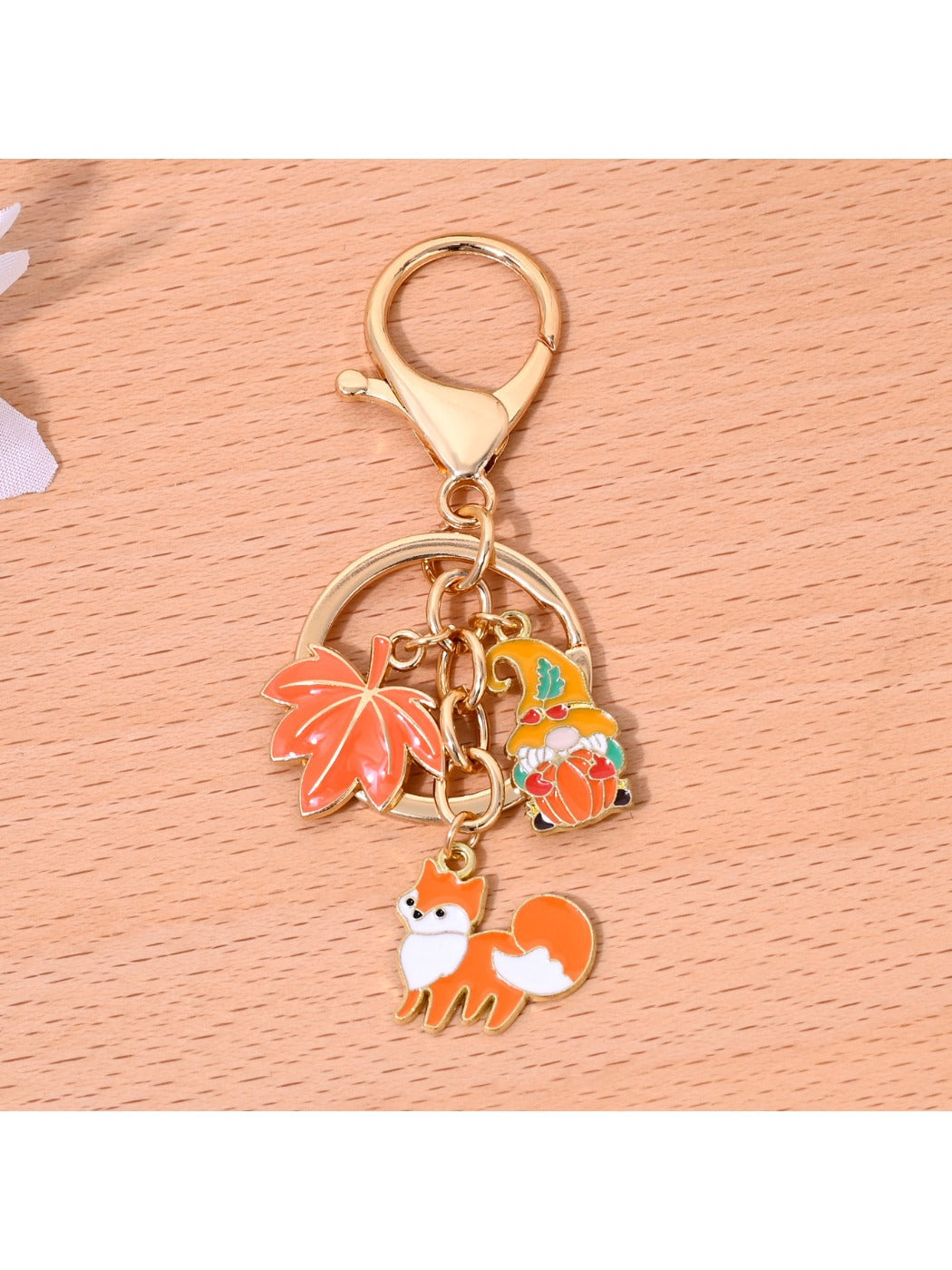 Orange keychain attached to a set of keys, highlighting its compact size