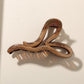 Beau - Glossy PS Curved Hollow Design Claw Clip