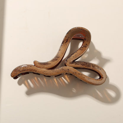 Beau - Glossy PS Curved Hollow Design Claw Clip