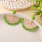 Earedge raffia fan shaped drop earrings photographed with natural lighting