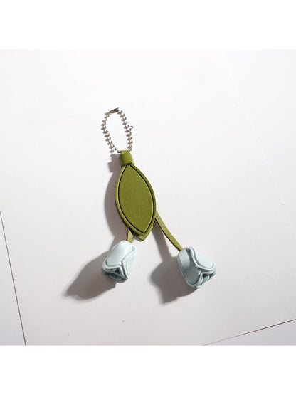 Side view of the pink tulip keychain showing detailed petal texture