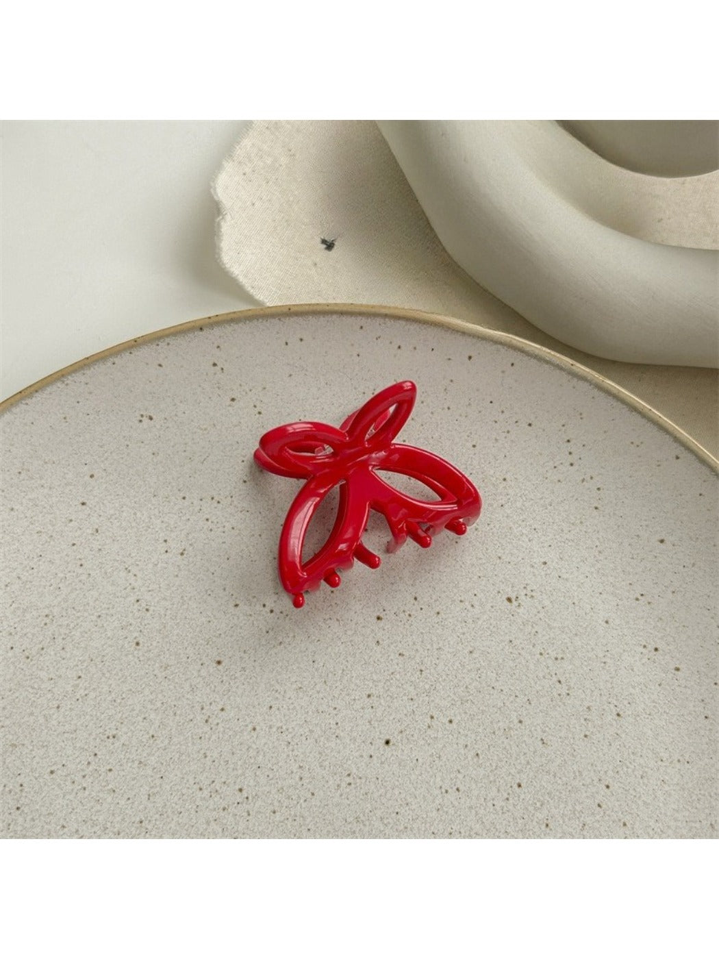 Top view of Beau butterfly claw clip showing symmetrical butterfly wing shape