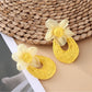 Sweet Raffia Flower Shaped Stud Earrings photographed with natural sunlight
