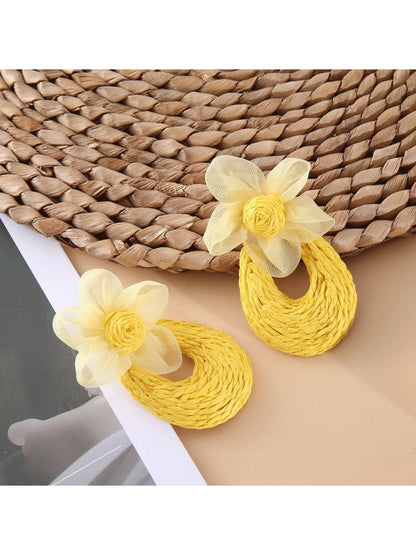 Sweet Raffia Flower Shaped Stud Earrings photographed with natural sunlight