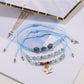 Side view of Lovra butterfly pendant on delicate small bead bracelet