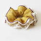Side view of Gifty ruffled scrunchie highlighting fabric layers